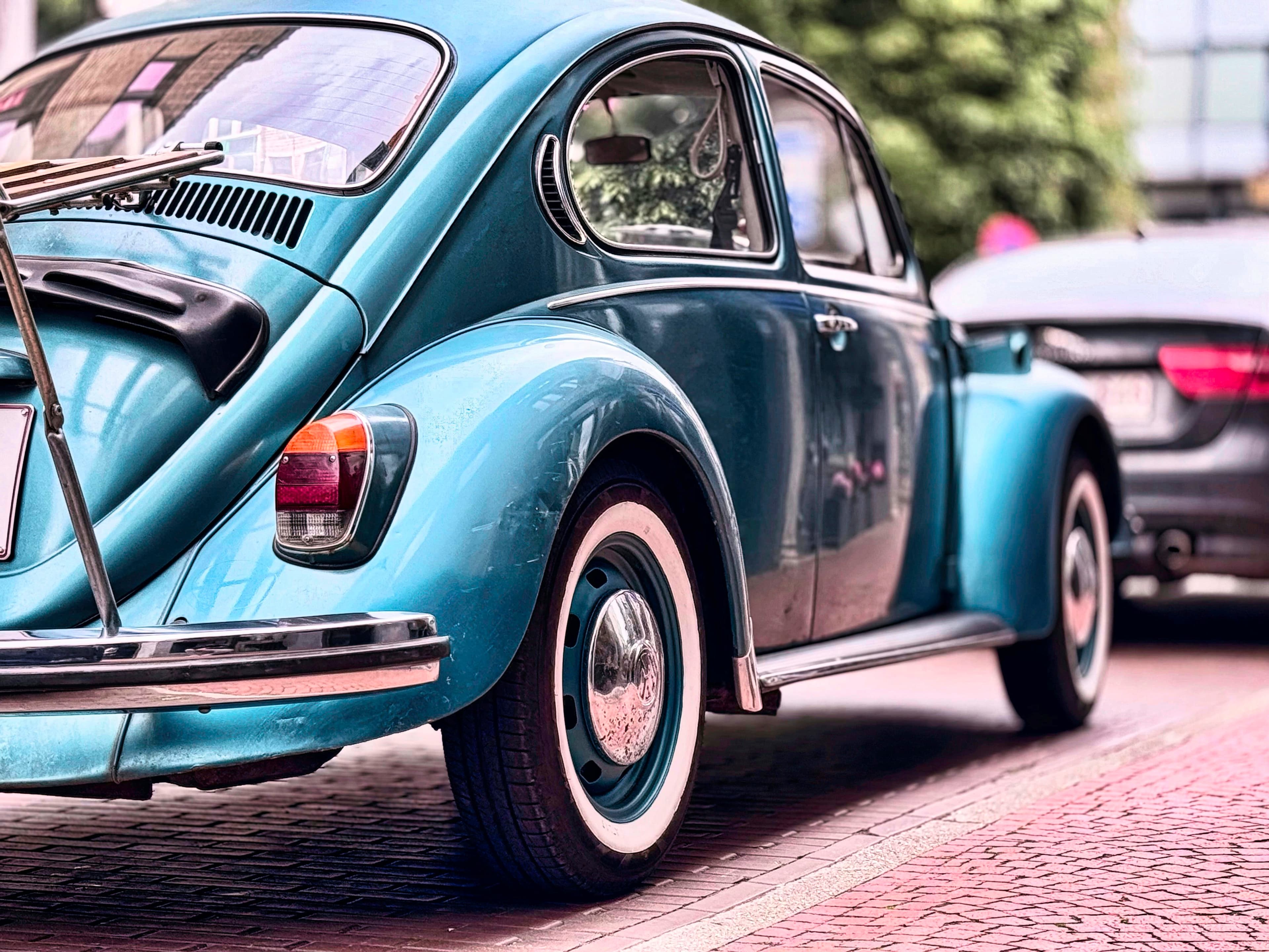 Vintage blue Volkswagen Beetle parked on a quiet street