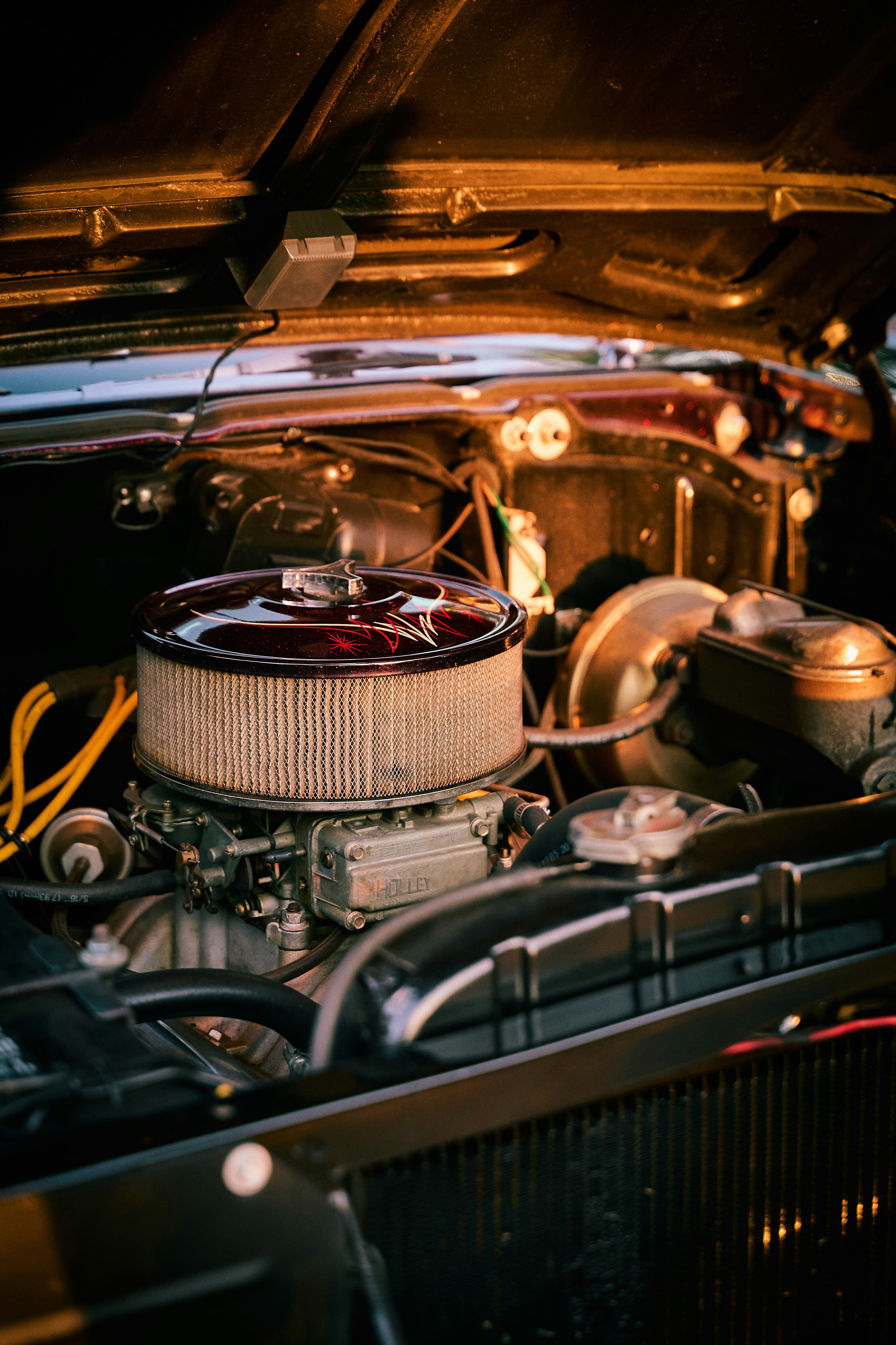 Close-up of a vintage car engine bay with chrome details