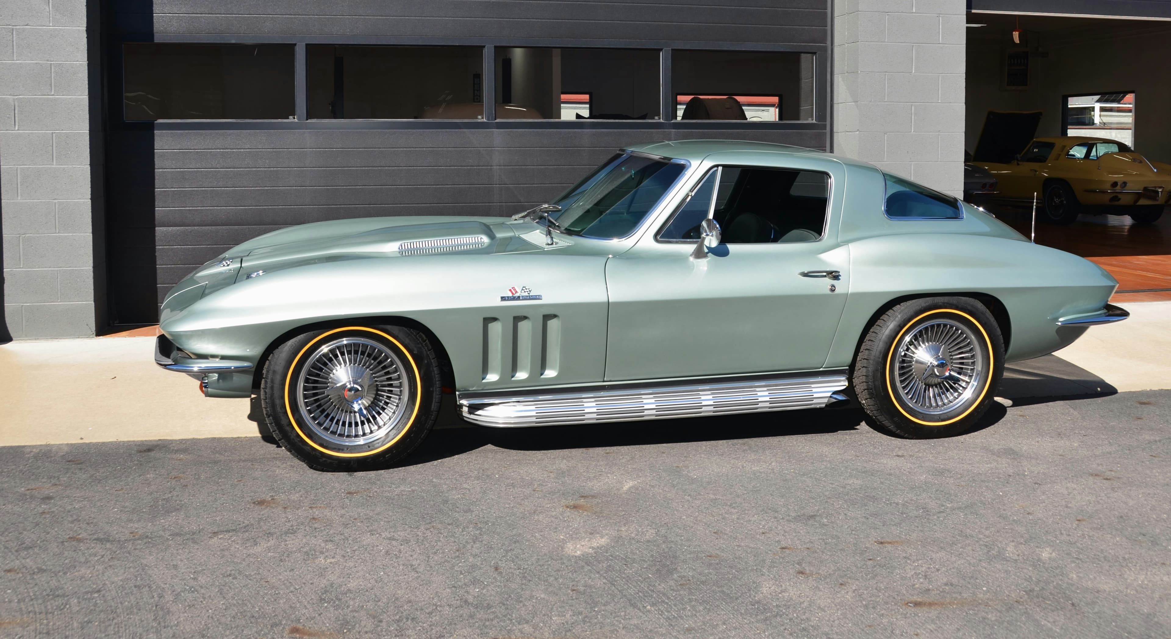 Light green mid-1960s Chevrolet Corvette Stingray coupe